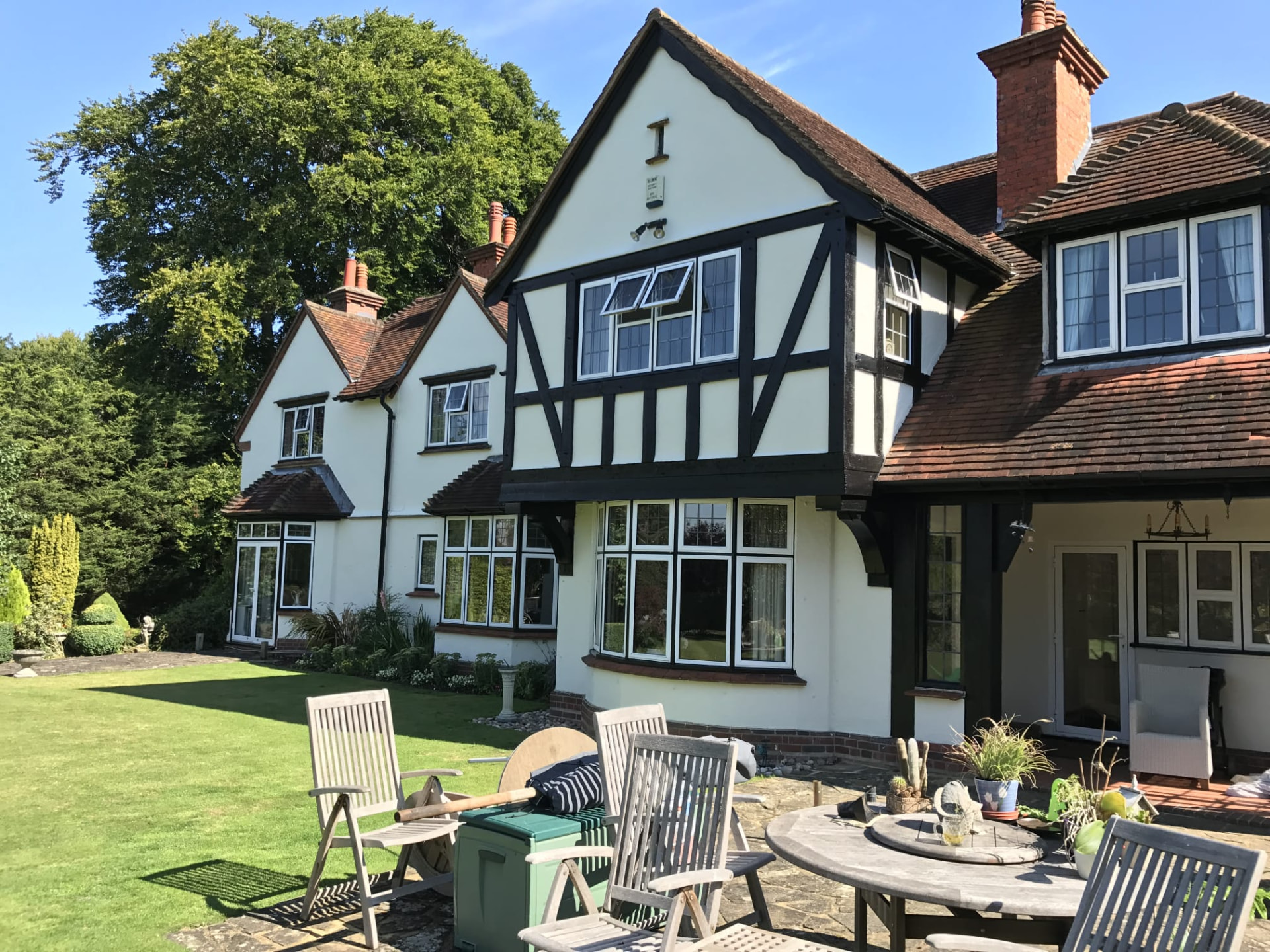 Refurbished detached period home with freshly decorated render, timber framing and restored windows